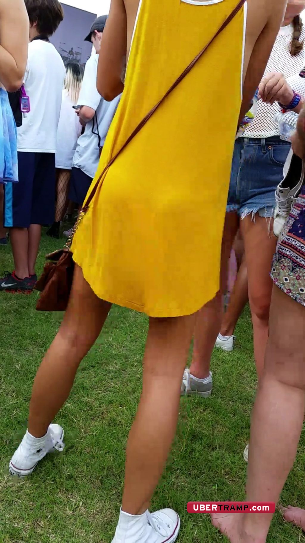 Visible outline of small round ass cheeks under yellow dress
